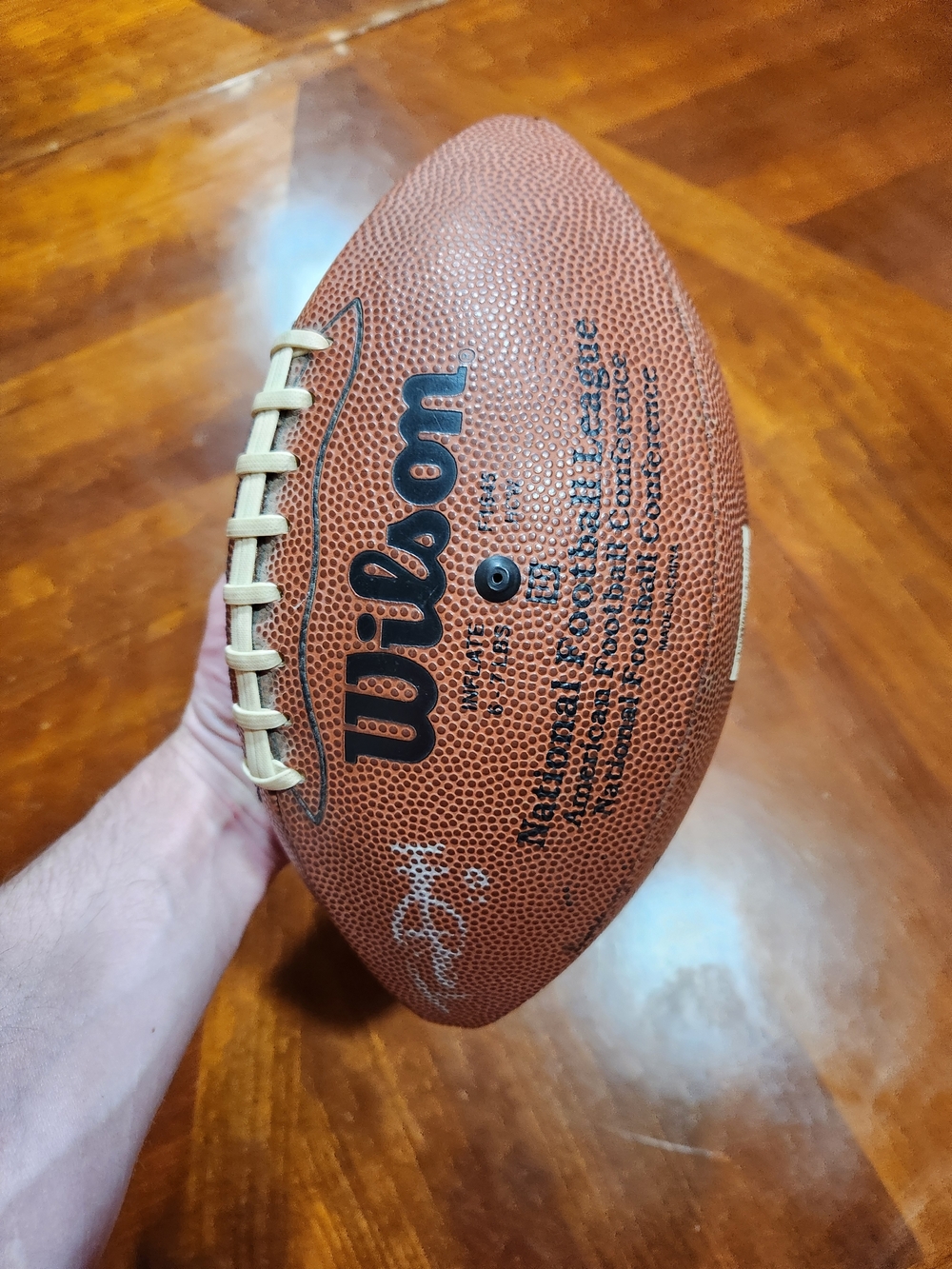 Wilson Brown Football with White Laces With 4 Unknown Autographs.